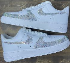 The famous Nike Air Force 1 but add a little bit of spice! These beautiful sneakers are blinged out on the Nike swooshes as well as the outside toe box. Rhinestones are hand placed on both the insides and outsides of the shoes *Depending on what color you choose for the rhinestones, shoes may be painted with high quality leather paint underneath the rhinestones to match * Many different sizes to choose from * Made to order * Sizes are in womens *Authentic Nikes bought from Nike store *Tested and Zapatillas Nike Air Force, Quinceanera Shoes, Swarovski Nike, Event Shoes, Bedazzled Shoes, Custom Air Force 1, Rhinestone Shoes, Bling Shoes, Cute Nike Shoes