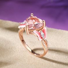 This sterling silver ring, a beautiful testament to the power of love, shines with a pink heart-shaped stone at its center. Fluttering gracefully on either side of the heart-shaped stone are two enamel pink butterflies. These delicate creatures, with their wings spread wide, seem to be dancing on the ring wall. Whether worn as a symbol of a deep and abiding love or beauty , this sterling silver ring with its pink heart-shaped stone and dancing butterflies is sure to captivate and delight.Carat W Dreamy Garden, Butterfly Heart, Power Of Love, The Power Of Love, Fancy Jewelry, Pink Butterfly, Pink Stone, Morganite, Pink Heart