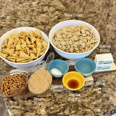 the ingredients to make homemade dog treats are displayed in bowls on a granite countertop