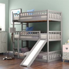 a bunk bed with a slide next to it