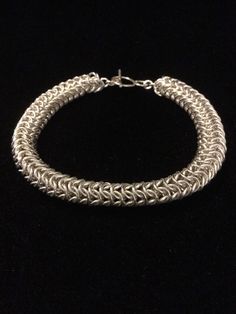 Sterling silver round weave chain mail bracelet with toggle clasp by thewatsonswares on Etsy https://www.etsy.com/listing/230075954/sterling-silver-round-weave-chain-mail Steampunk Bracelet, Chainmail Bracelet, Chainmaille Bracelet, Chain Maille, Woven Chain, Bike Chain, Chain Mail, Bracelet Silver, Toggle Clasp