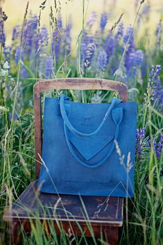 This blue leather tote bag is a classical design bag, it is a square form leather shoulder bag. It is a large leather bag, purse with pocket of an envelope design. This leather bag is from our collection 'Australia' and we call this leather purse 'Letter from Sidney'. The bag is capacious as it is approx 10 cm thick. You can also easily fit A4 size and bigger items. We use carefully selected genuine mat leather produced by Lithuanian manufacturers. There is a possibility to order different colou Tote Bag Organizer, Square Form, Large Leather Bag, Blue Tote Bag, Design Bag, Classical Design, Blue Tote, Envelope Design, Genuine Leather Bags