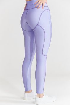 Highlight your curves with these figure-hugging with boxer-inspired stitching that defines and sculpts your silhouette. The best part? They are made from a comfy, flexible material that moves with you! Pair them with a matching cropped corset hoodie, zipper sweat hoodie, or triangle bra top from our collection. Details Colour: Lilac, Blue, Cream and Pink Design High rise waistline Stitch rock detail Thick waistband Super stretchy, soft, and comfortable Figure contouring fabric that sculpts your body Superior shape retention, even after all-day wear Available Sizes XS - UK 4- 6 S - UK 8 - 10 M - UK 12 - 14 L - UK 16 - 18 XL - UK 20 The model is 5’8” UK size 10 (US size 6) wearing a size S. Size & Fit: True to size Material: Stretchy rayon and spandex blend fabric. Care Instructions: Hand wa Compressive Tights With Contoured Waistband For Pilates, Squat Proof Elastane Tights For Athleisure, Squat Proof Athleisure Elastane Tights, Squat Proof Athleisure Tights, Compression Leggings With Contoured Waistband, Fitted Leggings With Contoured Waistband For Workout, Sporty Compression High-waisted Leggings, Fitted Tights With Wide Waistband For Training, Fitted Yoga Pants With Contoured Waistband For Workout