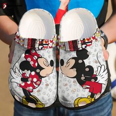 Introducing the Croc Shoes - Clog Shoes Mickey and Minnie mouse, the perfect footwear for all Disney enthusiasts! These adorable clog shoes feature the iconic Mickey and Minnie mouse designs, adding a touch of magic to your everyday style. Crafted with high-quality, lightweight Croslite material, these shoes offer superior comfort and durability. The breathable and water-friendly construction ensures all-day freshness and easy cleaning, making them ideal for any adventure. The adjustable ... Minnie And Mickey Shoes, Mickey And Minnie Crocs, Croc Ideas, Mickey Shoes, Disney Crocs, Minnie Mouse Cartoons, Mickey Mouse Shoes, Minnie Mouse Shoes, Croc Shoes