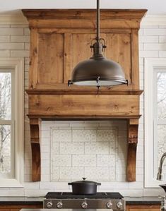 a stove top oven sitting inside of a kitchen