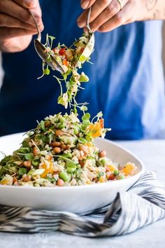 a person is spooning food out of a bowl