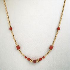 Red Love Necklace necklaces LUNARITY GARAGE Elegant Red Jewelry With Delicate Chain, Elegant Carnelian Necklaces In Yellow Gold, Red Carnelian Single Strand Necklace, Elegant Gold Beaded Necklaces For Valentine's Day, Elegant Ruby Necklace With Delicate Chain, Elegant Yellow Gold Carnelian Necklace, Elegant Gold Carnelian Beaded Necklaces, Red Beaded Chain Necklace Gift, Red Beaded Chain Necklace For Gift