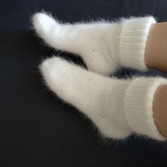 Very warm angora wool socks will keep your feet warm. The socks are thick. Also suitable for home  I can do in other colors. contact me beforehand Hand knit socks Very soft and warm socks. Socks will keep your feet warm in cold weather. Composition: angora (rabbit) yarn Size: choice a select Color: white naturale Ready to ship SIZE:  EU 36-37 (22-23 santimeters) - US 5-6 (8.7-9.1 inch) EU 38-39 (24-25 santimeters) - US 7-8 (9.5-9.8 inch) EU 40-41 (26-27 santimeters) - US 9-9.5 (10.2-10.6 inch) E Cozy Soft Socks, Comfortable Hand Knitted Winter Socks, Comfortable Thick Knitted Socks, Thick Warm White Socks, Soft Round Toe Socks For Gifts, Thick Knitted Socks, Thick Knitted White Socks, Lovebrush Chronicles, Yarn Socks