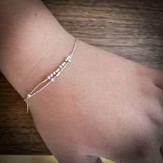 "This Morse code bracelet have beads floating on a delicate specialty chain. The mixed metal beads form a sophisticated, modern design. It is a subtle way to send your love message. Also a perfect daily reminder for love, inspiration, and mental health. ❤️ Matching morse code necklace: https://etsy.me/31Vv2Qm ∙ ∙ ∙ ∙ ∙ ∙ ∙ ∙ ∙ ∙ ∙ ∙ ∙ ∙ ∙ ∙ ∙ ∙ ∙ ∙ ∙ ∙ ∙ ∙ ∙ ∙ ∙ ∙ ∙ ∙ ∙ ∙ ∙ ∙ ∙ ∙ ∙ FEATURES ▶ All materials are sterling silver and 14K gold filled. Hypoallergenic. Suitable for sensitive skin. ▶ Be Message Names, Inspiration Words, Morse Code Necklace, Morse Code Bracelet, Love Inspiration, Morse Code, Dainty Bracelets, Metal Beads, Daily Reminder