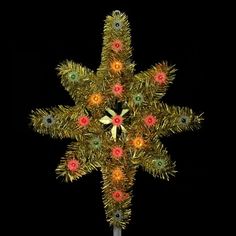 a lighted christmas tree topper with multicolored lights on it's star