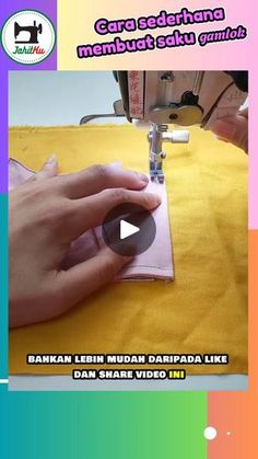 someone is using a sewing machine to sew something on a piece of yellow fabric