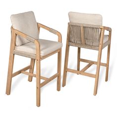 two wooden chairs with beige upholstered seats on each one and the other side