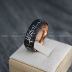 Music, Ring, Music Notes Ring, Music Wedding Ring, Piano Ring, Guitar Ring, Musician Jewelry, Music Jewelry, Black Wedding Band Teacher Ring   Custom made to order:  Ships in 4 - 6 weeks!   Handmade item Delivery from a small business in Canada Materials: Tungsten Band colour: Black with Rose Gold Interior Can be personalised Made to Order Piano Ring, Music Ring, Guitar Ring, Music Note Ring, Music Rings, Band Teacher, Music Wedding, Tungsten Carbide Wedding Bands, Black Wedding Band