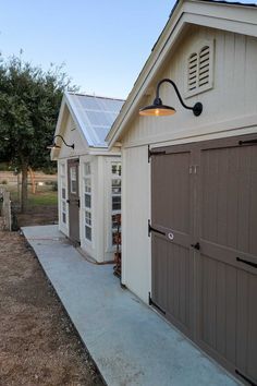 two garages side by side with one door open and the other closed on both sides