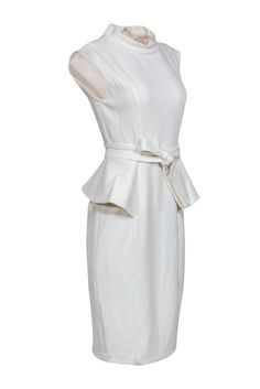 Sophisticated ivory dress in a figure flattering peplum silhouette. Take this dress to the next level by accessorizing it with a pair of dazzling statement earrings! Size 6 Shell: 63% Polyester, 33% Viscose, 4% Elastane Lining: 100% Polyester Stand collar neckline Concealed back seam zipper closure Sheath silhouette Sleeveless Peplum detail Bust 31" Waist 28" Shoulder to hem 43" French Girl Chic, Ivory Dress, Chic Shop, Buy Shoes Online, Ivory Dresses, French Girl, Size 6 Dress, Badgley Mischka, Fashion Labels