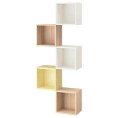 three shelves with different colors and shapes on each shelf, one is white and the other is yellow