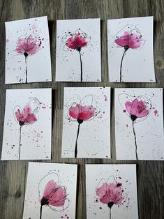 six cards with pink flowers painted on them