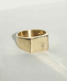 Men's Square Signet Ring Hallmarked Engagement and Wedding Jewelry by Macha Studio Brooklyn NYC Symbolic 14k Gold Initial Ring With Polished Finish, Promise Ring With Initials In 14k Gold, Timeless Gold Signet Ring With Hallmarks, Timeless Gold Signet Ring For Promise, Symbolic Yellow Gold Signet Ring For Promise, Formal Yellow Gold Stamped Engraved Ring, Yellow Gold Engraved Initial Ring For Promise, Timeless Gold Sterling Silver Initial Ring, Symbolic 14k Gold Signet Ring For Promise