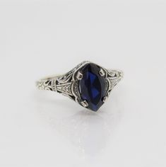 Sterling Silver Blue Sapphire Filigree Ring ....Marked 925...Total of weights 2.1grams..Size 10...Measure of Face 10.1MM...It's in very good condition. Mens Blue Topaz Rings, Sapphire Engagement Ring Men, Blue Filigree Ring Hallmarked For Anniversary, Blue Sapphire Ring Stamped 925, Blue Ring With Intricate Design Fine Jewelry, Sterling Silver Ring With Intricate Blue Design, Sterling Silver Rings With Intricate Blue Design, Blue Sterling Silver Rings With Intricate Design, Sterling Silver Rings With Intricate Design In Blue