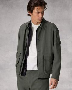 The Cade. Outfitted with utilitarian flap pockets, our jacket is perfectly oversized and crafted in a Japanese tropical wool. Featuring adjustable details for a personalized fit. Dusty Green XXL Oversized Utility Jacket With Patch Pockets For Work, Workwear Shacket With Lapel Collar And Multiple Pockets, Workwear Shacket With Multiple Pockets And Lapel Collar, Urban Cargo Outerwear For Work, Urban Cargo Style Outerwear For Workwear, Collared Shacket With Multiple Pockets For Workwear, Relaxed Fit Button-up Outerwear With Cargo Pockets, Oversized Khaki Shacket With Flap Pockets, Khaki Workwear Shacket With Multiple Pockets