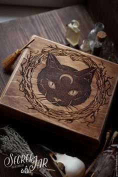 a wooden box with an image of a cat on it