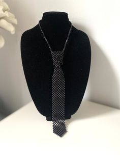 "Black Pearl Neck Tie Faux Pearl Necklace, unique statement for you Length: 18\" + 5\" (46 +12cm) Drop: 12\" (31 cm) Available in ivory: https://www.etsy.com/listing/1556328332/tie-necklace-pearl-tie-necklace-hand Enjoy exploring in my jewelry store for more styles of pearl necklaces, maybe you will discover what you are looking for. Thank you! https://www.etsy.com/shop/BravaFashionJewelry Hi and welcome to BravaFashionJewelry It is very important that you are completely satisfied with your purc Black Ties Jewelry For Gift, Black Jewelry With Ties For Gifts, Gift Black Jewelry With Ties, Elegant Adjustable Choker For Night Out, Elegant Black Formal Choker, Adjustable Black Choker For Party, Elegant Adjustable Necklace For Night Out, Formal Black Beaded Necklace, Adjustable Black Beaded Choker For Parties