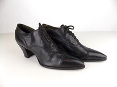 "Pair of women's antique brown leather shoes from the late 1910's to early 1920's. Lace up style with stacked wood heel, and pointed leather cap toe. Heel height 2\". Brand: Walk-Over Walk-Over is the trademark name of the George E. Keith Company, founded in Massachusetts in 1874. The Walk-Over name was first used in 1898. Their women's shoe line was introduced in 1902. Good condition, consistent with age. (These shoes are 100 years old.) They are still wearable for a photo shoot, theater produc 1910 Shoes, 1920 Style, Historical Shoes, Drawing Challenges, Brown Leather Shoes, Black Dress Shoes, Old Shoes, Wood Heel, Black Leather Shoes