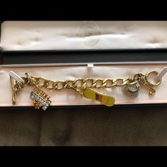 Brand New Nwot Juicy Couture Gold Charms Bracelet With Original Box - #1 Friend Juicy Charm - Limited Edition 2011 Snow Bored Juicy Charm You’ll Receive Everything In Pictures. Please Review All Pictures. Such A Gorgeous Bracelet Set! Designer Yellow Jewelry As Gift, Designer Yellow Jewelry For Gifts, Heart Locket Bracelet, Juicy Couture Charms Bracelet, Juicy Couture Bracelet, Toggle Clasp Bracelet, Arrow Bracelet, Locket Bracelet, Vintage Charm Bracelet