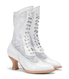 a pair of white boots with lace on them