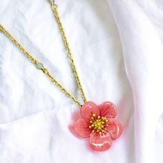 This necklace is a blooming beauty. The delicate design of an enamel plum blossom adorning the clavicle adds a touch of elegance to any outfit. Bring a little floral flair to your wardrobe and make a statement with this unique piece. Collection: Garden Series Product Type: Necklace Material: 18k gold plating brass, enamel Charm Dimensions: Height: 20 mm, Width: 20 mm Necklace length: 41 cm + 5.5 cm / 16.1 inches + 2.2 inches (Adjustable Chain) Feminine Blossom Jewelry For Spring, Enamel Flower Pendant Necklace With Charm, Enamel Flower Pendant Necklace With Flower Charm, Enamel Necklaces With Flower Charm And Pendant, Blossom Flower Jewelry For Spring, Spring Blossom Jewelry With Flower Decoration, Spring Flower-shaped Rose Gold Necklaces, Rose Gold Flower Necklace For Spring, Spring Rose Gold Flower Necklace