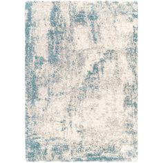 a blue and white rug with faded edges