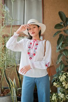 "Gorgeous vintage Hungarian floral embroidered blouse. The blouse features long sleeves with embroidered flowers. Made from soft cotton. Condition: In great vintage condition. Made in Switzerland Details and Measurements (Inch) size estimate: m *Measurements are taken in inches with the garment laying flat. BUST: 42 \" FULL LENGTH: 23 \" SLEEVE LENGTH: 26 \" from neck 18\" form armpits *If you are not sure about size please feel free to contact me I would be happy to help all questions and reque Long Sleeve Cotton Blouse With Embroidered Cuffs, Long-sleeved Cotton Blouse With Embroidered Hem, Long Sleeve Cotton Blouse With Embroidered Hem, Bohemian Cotton Blouse With Embroidered Cuffs, Cotton Blouse With Embroidered Hem And Long Sleeves, Folk Style Long Sleeve Embroidered Peasant Top, Folk Style Embroidered Hem Long Sleeve Peasant Top, Folk Style Long Sleeve Peasant Top With Embroidered Hem, Spring Long Sleeve Embroidered Top