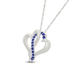 Two hearts collide in the prettiest way in this sweet and shimmering necklace. Sterling silver Two open hearts are entwined in the polished pendant Along the center, a curved ribbon of round blue lab-created sapphires shines 18-inch rope chain; spring ring clasp Sapphire Heart Necklaces For Anniversary, Sapphire Heart Necklace For Anniversary, Heart-shaped Sapphire Necklace For Anniversary, Elegant Sapphire Necklaces For Valentine's Day, Elegant Blue Open Heart Necklace, Elegant Blue Double Heart Necklace, Elegant Blue Heart Necklace For Mother's Day, Sapphire Heart Pendant For Anniversary, Valentine's Day Sapphire Sterling Silver Necklace