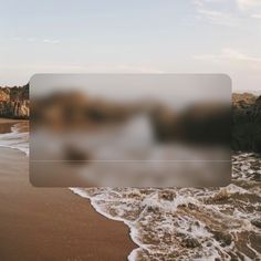 a blurry photo of the beach with waves coming in