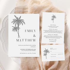 the palm tree wedding stationery suite is shown on top of a white plate and beige linen