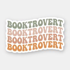 a sticker with the words booktrovert in different colors and font on it