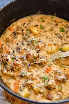 potato and sausage chowder in a skillet with text overlay