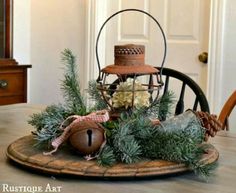 a table topped with a basket filled with pine cones and other things on top of it