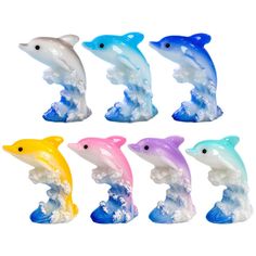 six dolphin figurines are shown in different colors