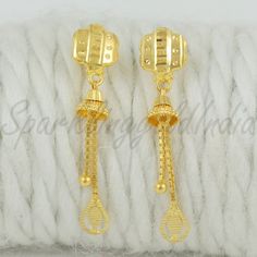 Celebrate the essence of Indian heritage with these radiant 22k gold earrings. Each earring is meticulously designed with traditional patterns that catch the light and add a regal touch to your look. Perfect for both festive occasions and elegant evenings, these earrings are a testament to the rich history of Indian jewelry, offering a blend of classic beauty and modern sophistication. 22k gold earrings handmade jewelry made in India Metal real gold, Purity 22k gold,  length is 3.3 centimeter an 22k Yellow Gold Bridal Earrings As Gift, Yellow Gold Danglers For Formal Festivals, Gold Earrings With Elegant Design For Ceremonial Use, 22k Yellow Gold Bridal Earrings For Gift, Ceremonial Yellow Gold Bridal Earrings With Latkans, Gold 22k Danglers For Formal Occasions, 22k Gold Danglers For Formal Occasions, Yellow Gold Drop Earrings For Festivals, Gold Traditional Earrings With Elegant Design