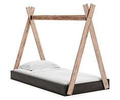 a bed frame made out of wood with white sheets and pillows on the bottom side