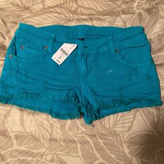 Nwt Carmar Denim Shorts Teal Color Denim Cutoff Style Bought At Lf Store Classic Cutoff Mid Rise Short Zipper Fly Brand New, Never Worn With Tags Size 25 Blue Ripped Cotton Bottoms, Ripped Blue Cotton Bottoms, Blue Frayed Hem Shorts, Blue Jeans With Frayed Hem Short Leg, Blue Bottoms With Frayed Hem And Short Leg, Blue Bottoms With Frayed Hem Short Leg, Ripped Cotton Bottoms Of Short Length, Blue Jean Shorts With Pockets, Ripped Blue Short Bottoms