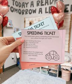 someone is holding up two tickets for the speed driving ticket contest on valentine's day