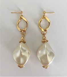 "Large Faux Baroque Pearl Drop Pierced Earrings on Gold Tone Curb Chain with Ribbed Gold Bead Caps Natural Pearl Colored Baroque Faux Pearls Dangle From Gold Tone Curb Chain with Small Ball Tops Earrings Measure 2 1/2\" Long x 3/4\" Wide at Pearl Baroque Pearls are Oblong Shaped Gold Tone Earring Backs Earring Pair Weighs 13 Grams New Vintage From the 1980's COMPLIMENTARY DOMESTIC SHIPPING" Gold Pearl Earrings With Dangling Beads For Party, Party Gold Beaded Pearl Earrings, Gold Beaded Chain Earrings For Wedding, Elegant Dangling Bead Pearl Earrings For Party, Elegant Dangling Pearl Earrings For Party, Adjustable Gold Pearl Earrings For Party, Elegant Festive Earrings With Beaded Chain, Elegant Baroque Pearl Earrings For Party, Elegant Beaded Pearl Earrings For Festive Occasions