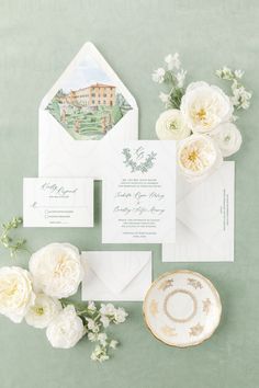 the wedding stationery was done in soft green and white, with an elegant envelope