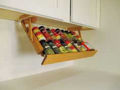 an overhead spice rack holds spices and seasonings