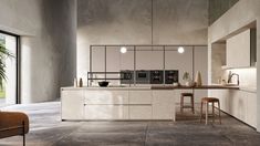 a modern kitchen with an island counter and stools next to it, in front of a large window