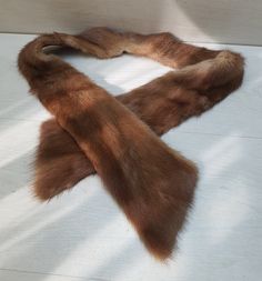 From a local estate, this original Brown Fox Tails fur wrap or scarf is in great condition. No flaws that I can see. It will be great for any collection or outfit. PLEASE NOTE THAT THE FOX IS VINTAGE MADE AROUND 1970's. ALL IS OLD STOCK. It is great for Viking, Celtic or Warrior outfits. Size: You can see the measurements in the photos. If you require any more information or pictures please contact me. Warrior Outfits, Fox Tails, Fox Fur Scarf, Warrior Outfit, Vintage Fox, Fur Wrap, Fur Scarf, Cardiff, Taxidermy