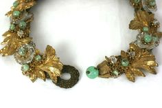 For Sale on 1stDibs - Early Miriam Haskell 1930s Gilt and Venetian Glass Collar, of signature Russian Gilt baroque leaves and flowerheads, hand made crystal flowers, and green Elegant Green Jewelry With Vintage Charm, Elegant Green Jewelry For Vintage Events, Vintage Bead Caps Jewelry For Party, Vintage Party Jewelry With Bead Caps, Vintage Green Decorative Jewelry, Vintage Glass Jewelry For Weddings, Vintage Gold Jewelry With Bead Caps, Elegant Vintage Collection Jewelry, Vintage Green Jewelry For Vintage Events