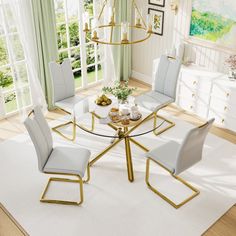 a glass table with four chairs around it